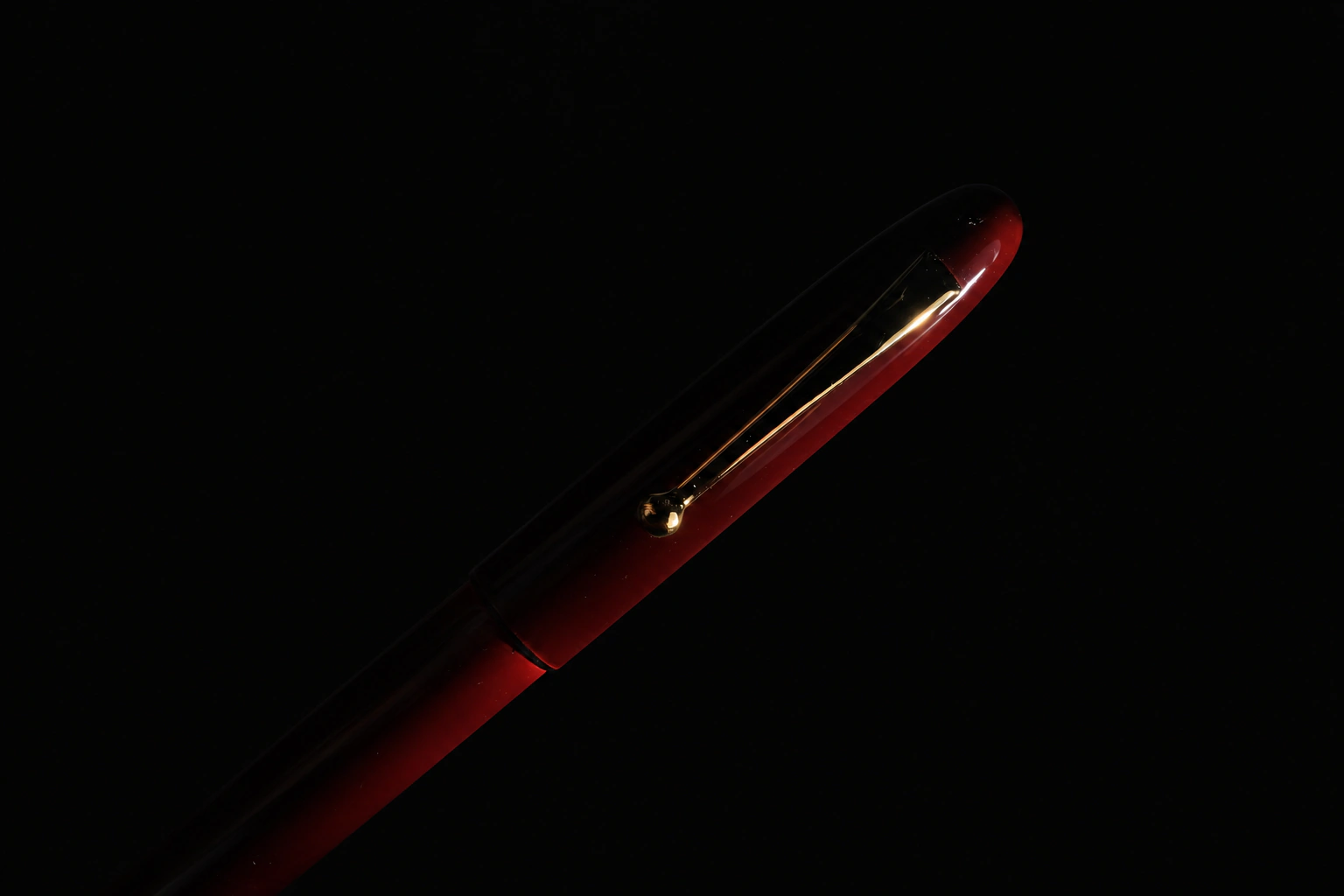 Red-and-black lacquer pen with a gold clip